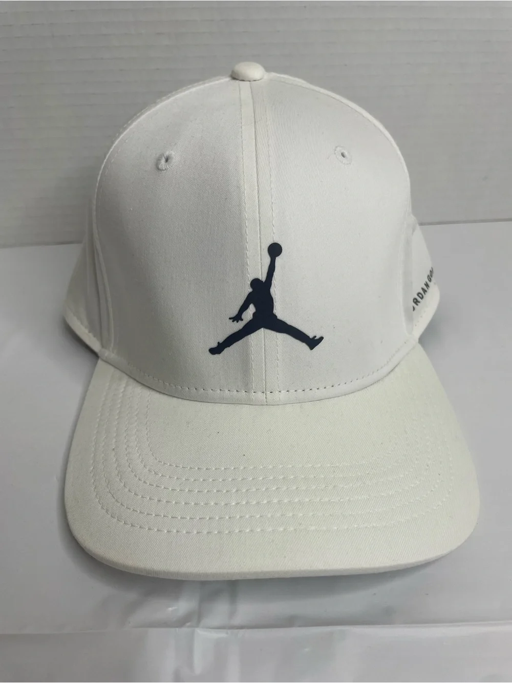 White Jordan Golf Dri-Fit adjustable SnapBack Cap with Black Jumpman Logo